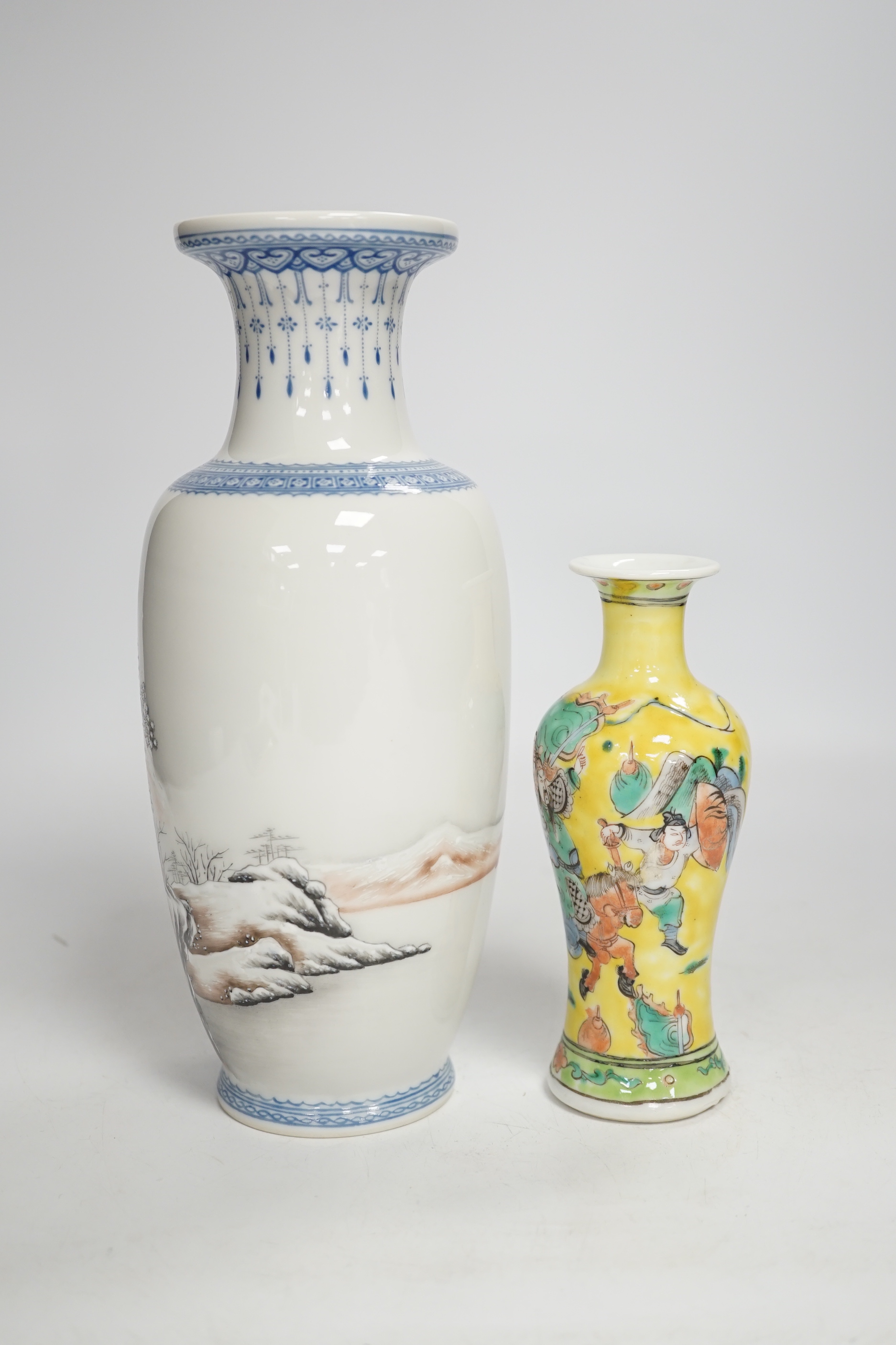 A Chinese Republic period enamelled porcelain ‘winter scene’ vase, and a yellow ground ‘warriors’ vase, largest 24cm high